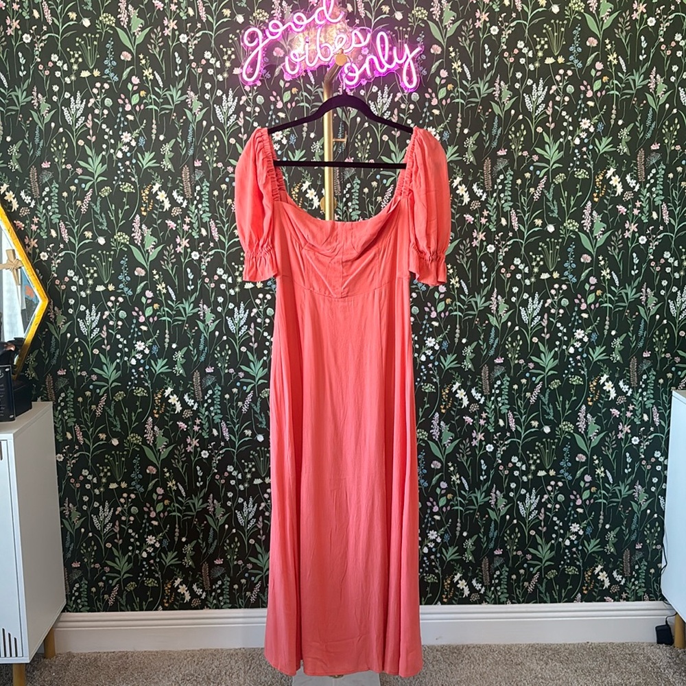 Long slit dress with sleeves that’s can be worn up off the shoulder.